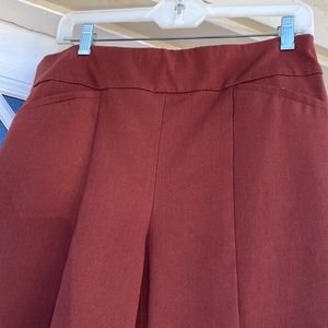 Chico’s SoSlimming size 1.5 (12).  Short —Brick/burnt orange is the  color